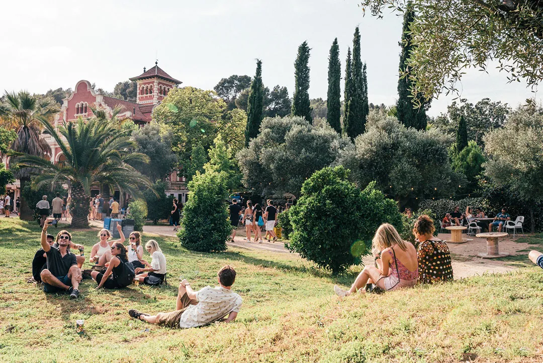 Mediterranean garden of the estate, guests on the lawn