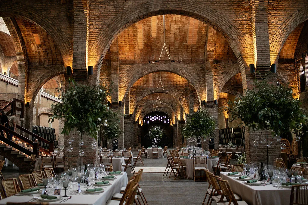 Brick vaulted hall at Cavas Codorníu set for dinner