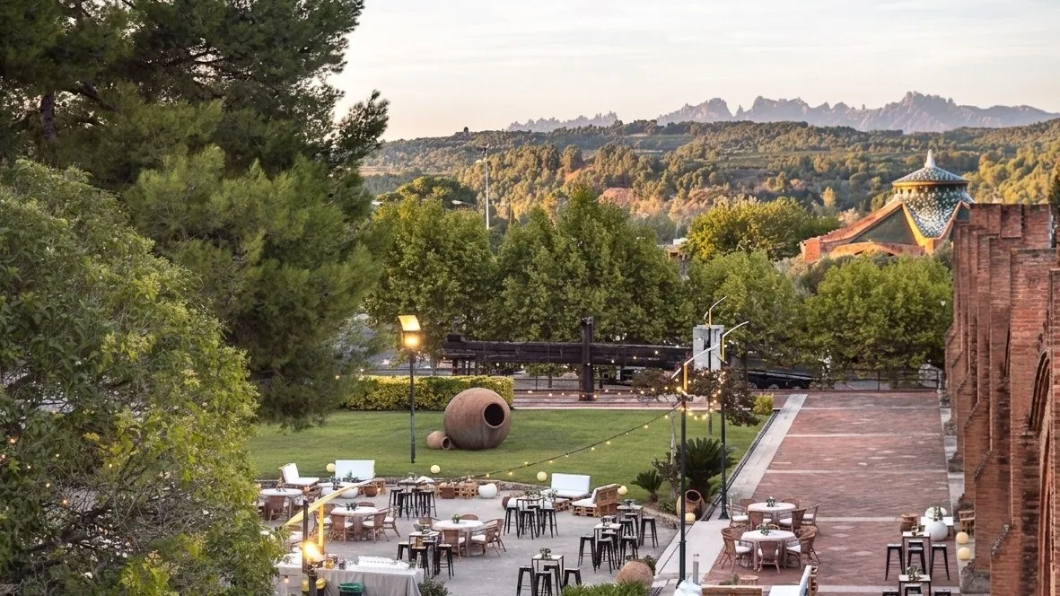 Garden of Cavas Codorníu in Barcelona with hills in the distance