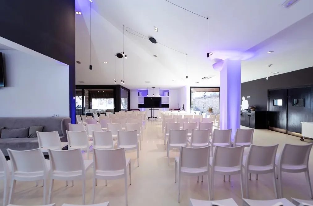 Reception room with purple lighting at Espacio Villafranca in Madrid