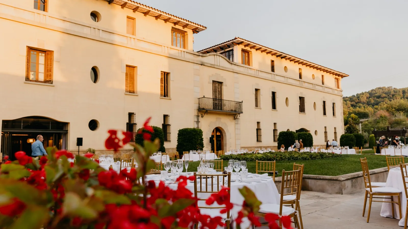 Tables set in front of the Freixenet estate building
