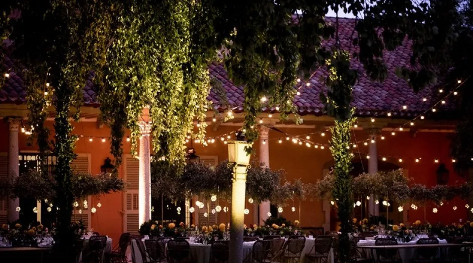 Evening dinner in the gardens of La Casa de Mónico with string lights, Madrid