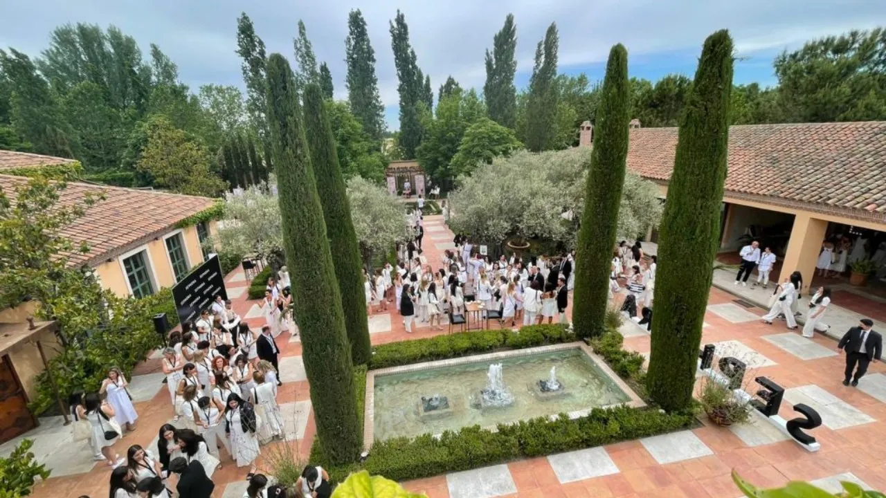 Aerial view of the courtyard of La Quinta de Jarama with pool and cypress trees, corporate event