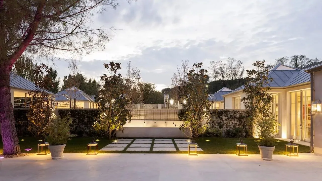 Gardens of Laureana Business Center at dusk, terrace and ambient lighting